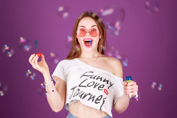 Funny girls, filming on purple background